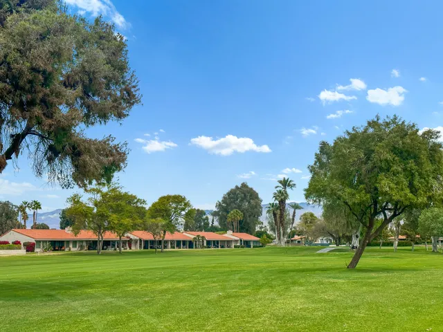 a view of a golf course with a lake