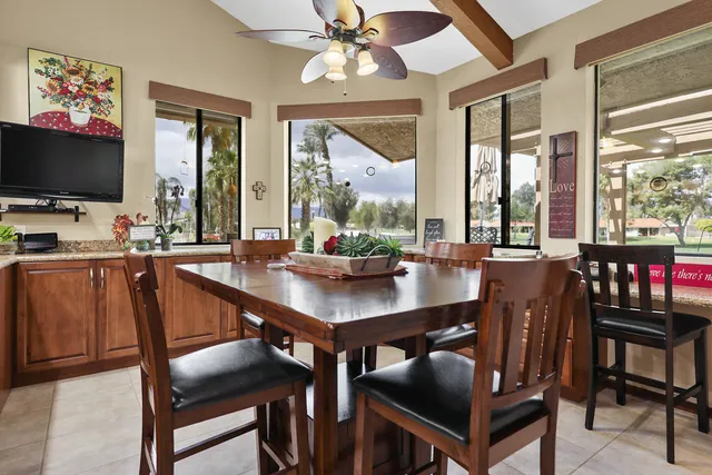 a view of a dining room with furniture window and outside view