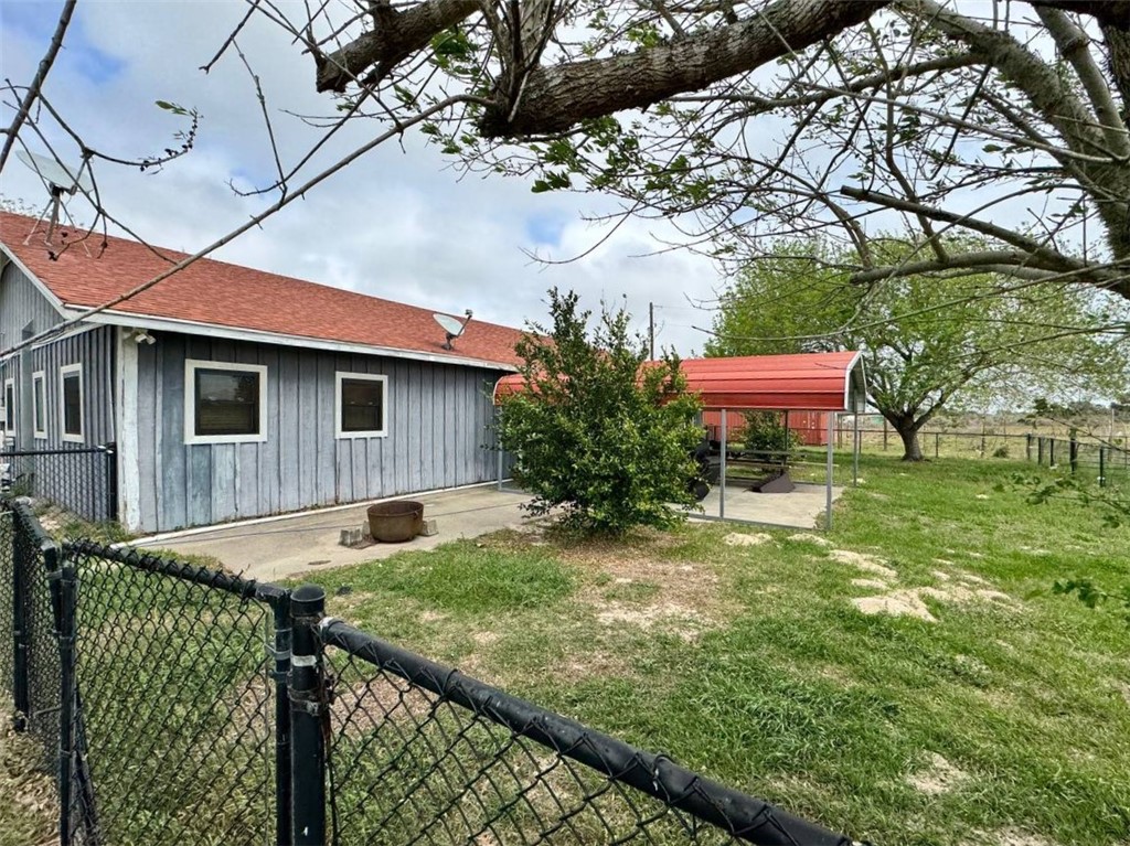 350 Quail Meadow Road Seadrift, TX 77983 - Photo 20 of 22 a backyard of a house with table and chairs