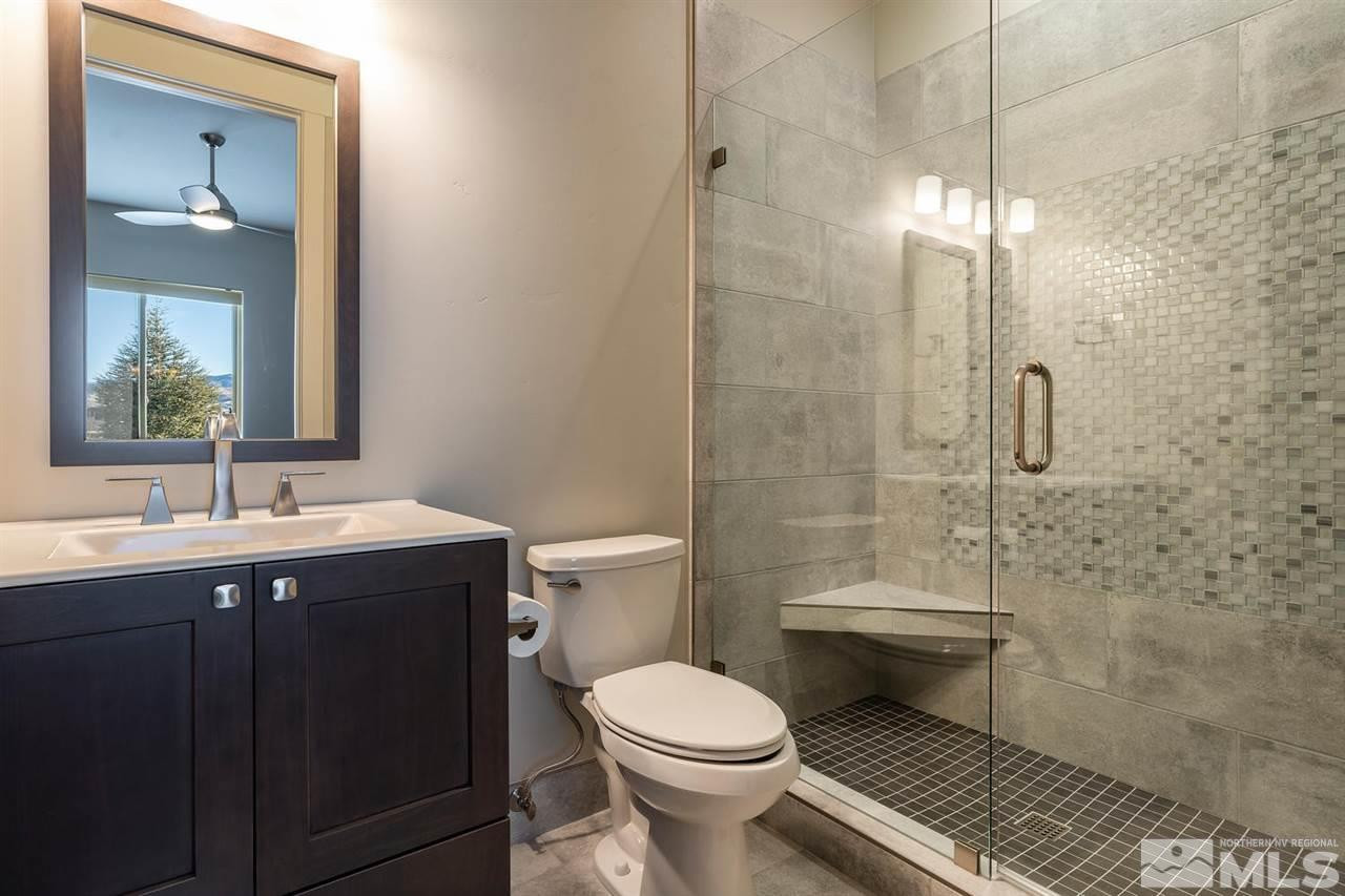 4920 Gila Bend Road Reno, NV 89511 - Photo 13 of 23 a bathroom with a toilet sink and shower