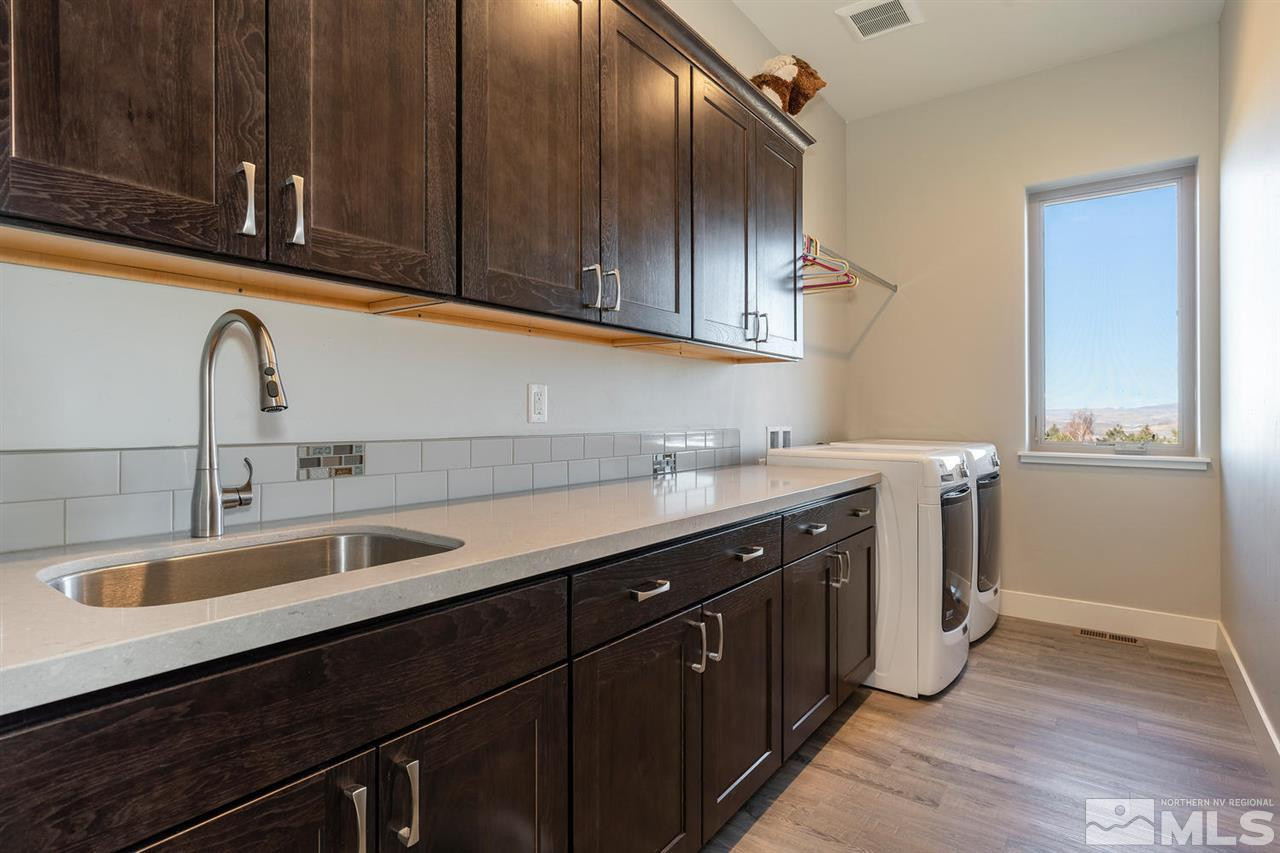 4920 Gila Bend Road Reno, NV 89511 - Photo 14 of 23 a kitchen with a sink and cabinets