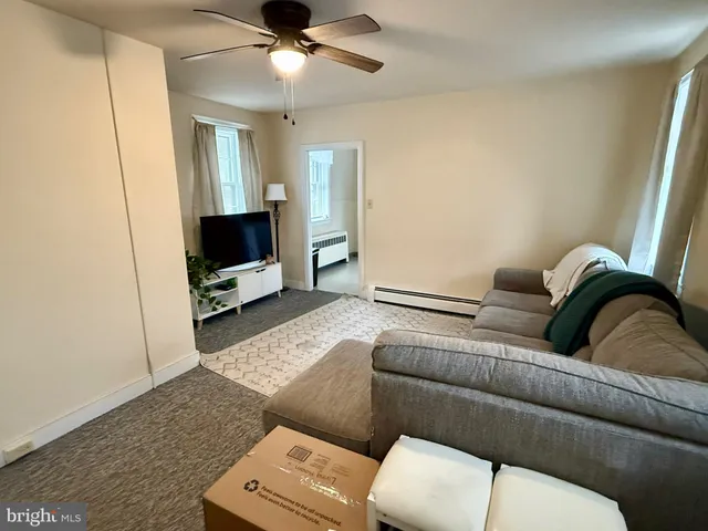 a kitchen with a refrigerator sink stove and cabinets