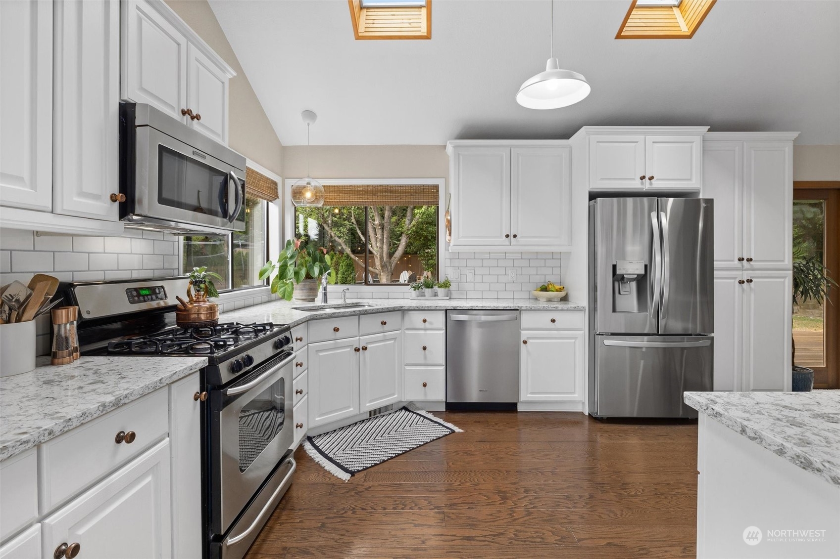 20622 37th Avenue Southeast Bothell, WA 98021 - Photo 11 of 38 a kitchen with granite countertop a sink stainless steel appliances and cabinets