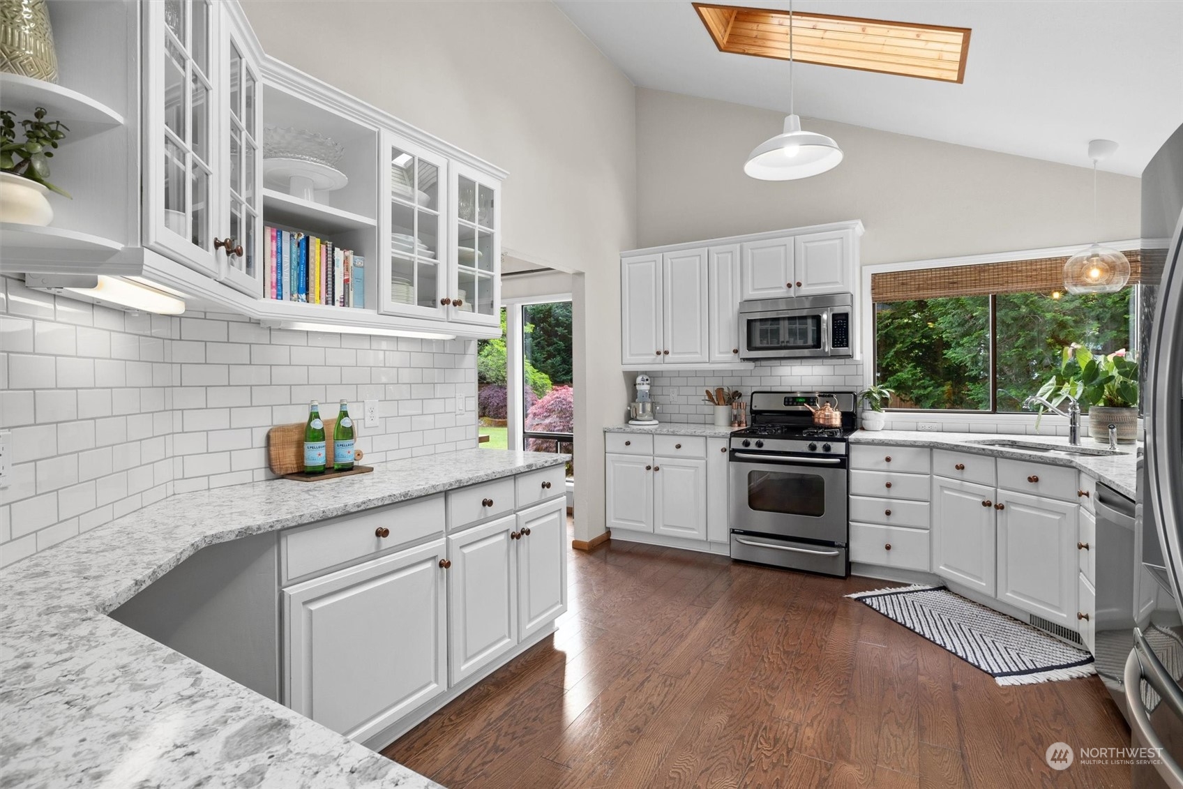 20622 37th Avenue Southeast Bothell, WA 98021 - Photo 12 of 38 a kitchen with granite countertop white cabinets and white appliances