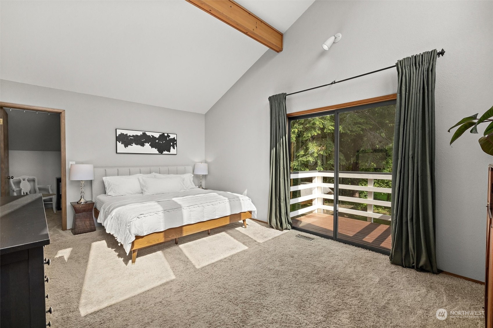 20622 37th Avenue Southeast Bothell, WA 98021 - Photo 18 of 38 a bedroom with a bed and a flat tv screen next to a window