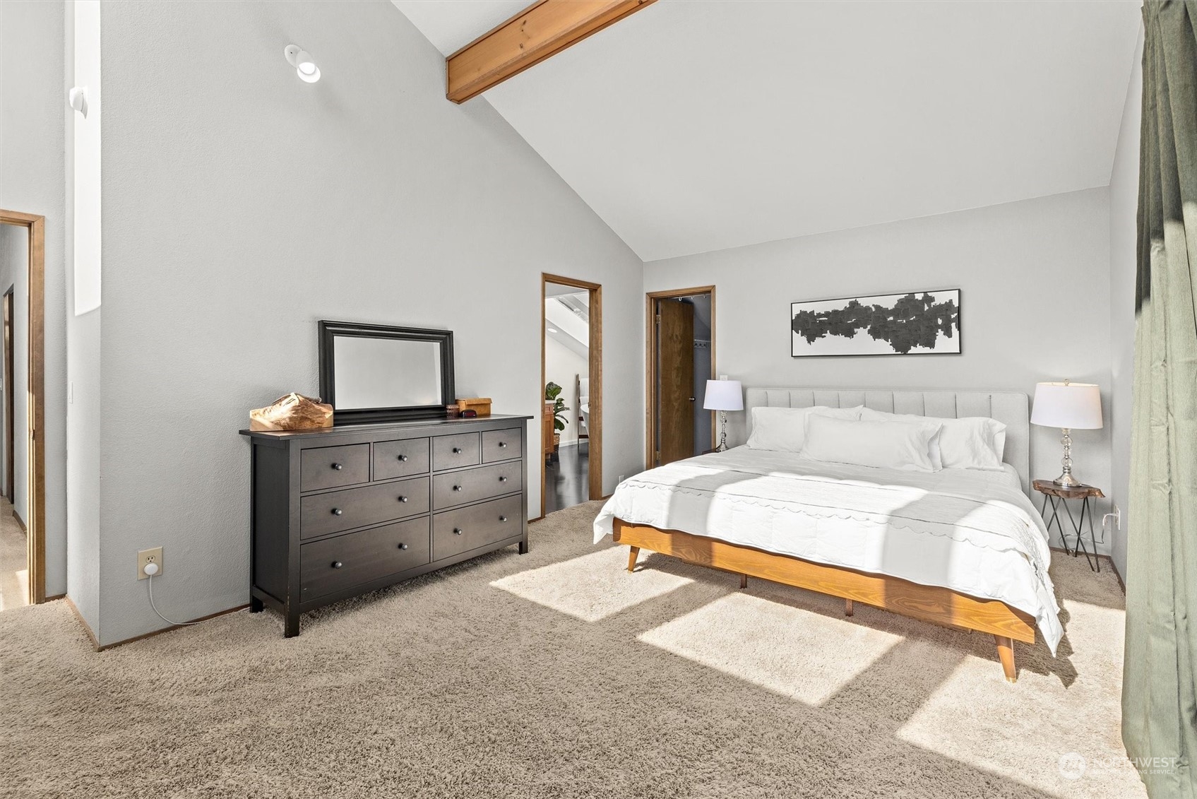 20622 37th Avenue Southeast Bothell, WA 98021 - Photo 19 of 38 a bedroom with a bed and a flat tv screen on dresser