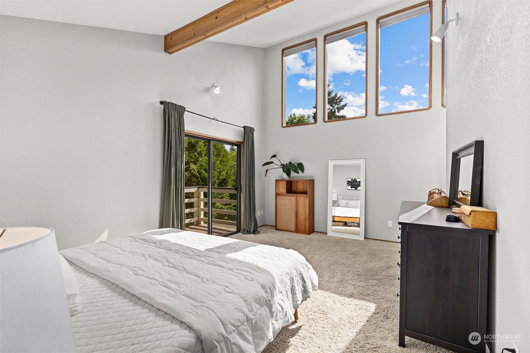 20622 37th Avenue Southeast Bothell, WA 98021 - Photo 20 of 38 a bedroom with a bed and dresser with mirror
