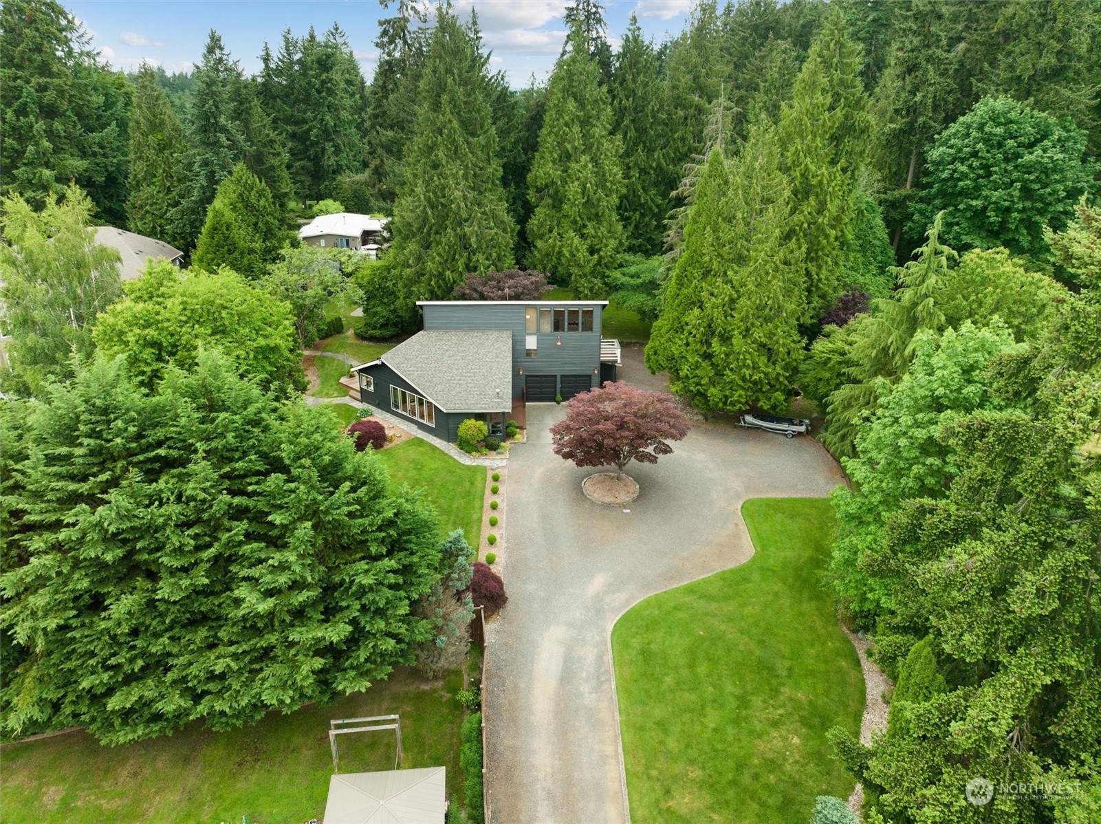 20622 37th Avenue Southeast Bothell, WA 98021 - Photo 2 of 38 an aerial view of a house with a yard and lake view