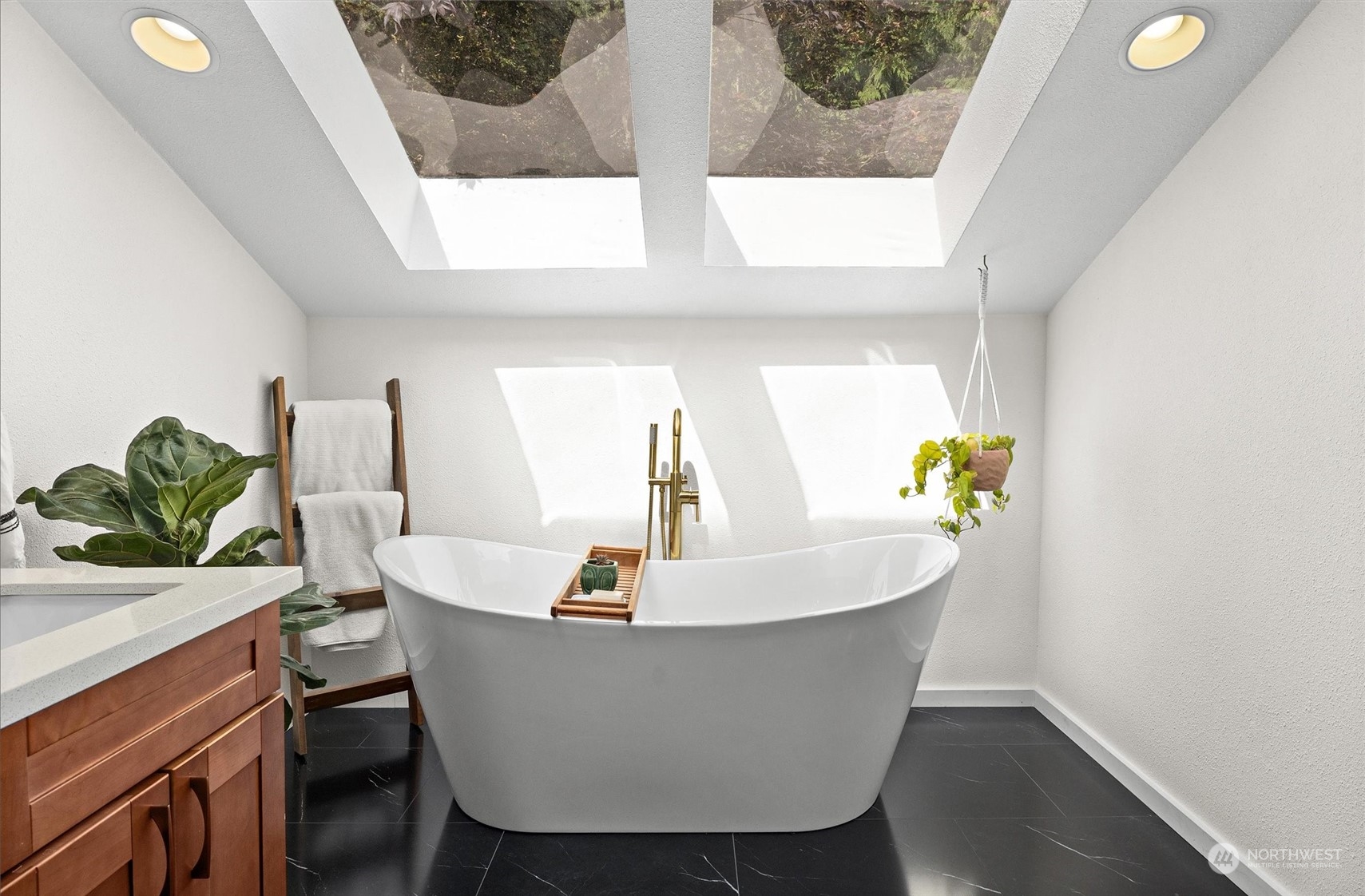 20622 37th Avenue Southeast Bothell, WA 98021 - Photo 22 of 38 a white bath tub sitting next to a bathroom sink