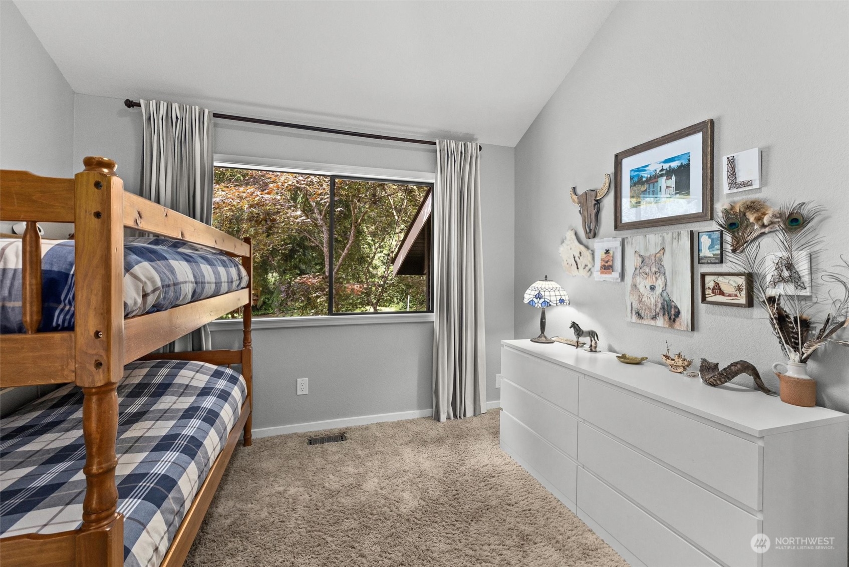 20622 37th Avenue Southeast Bothell, WA 98021 - Photo 24 of 38 a bedroom with a bed and large windows