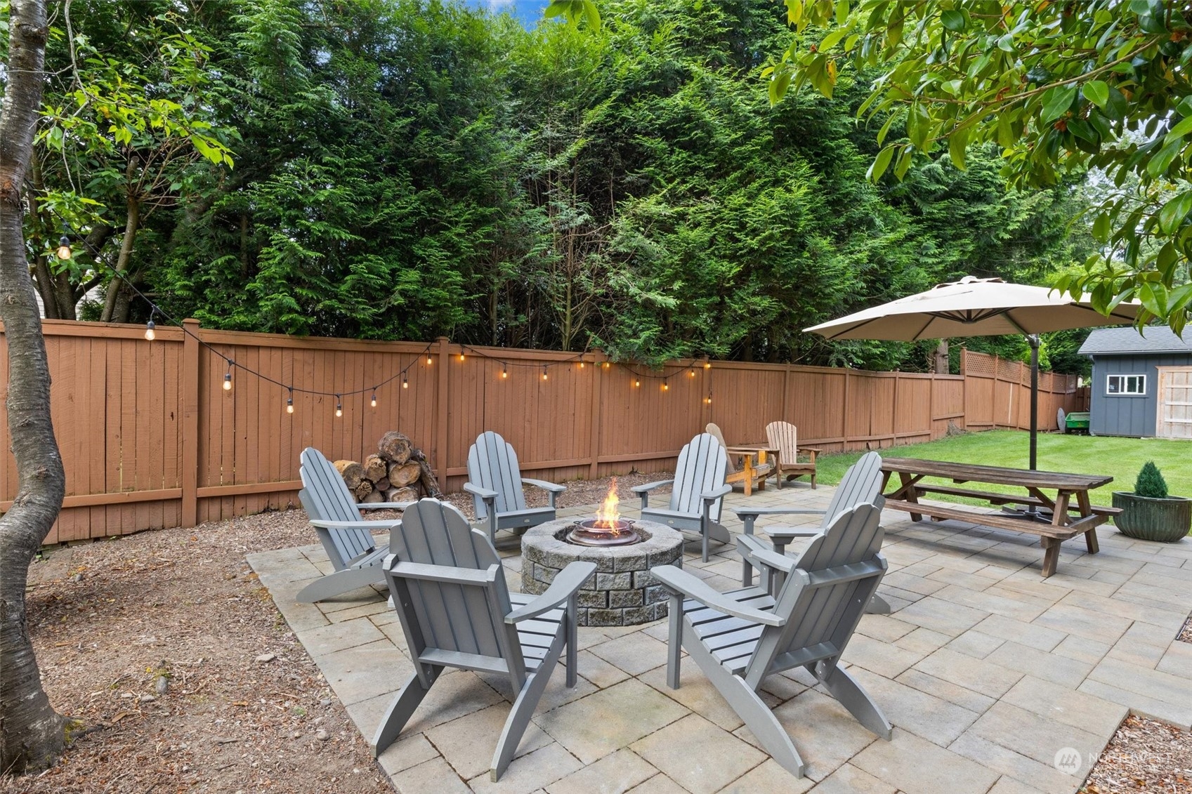 20622 37th Avenue Southeast Bothell, WA 98021 - Photo 32 of 38 a backyard of a house with table and chairs