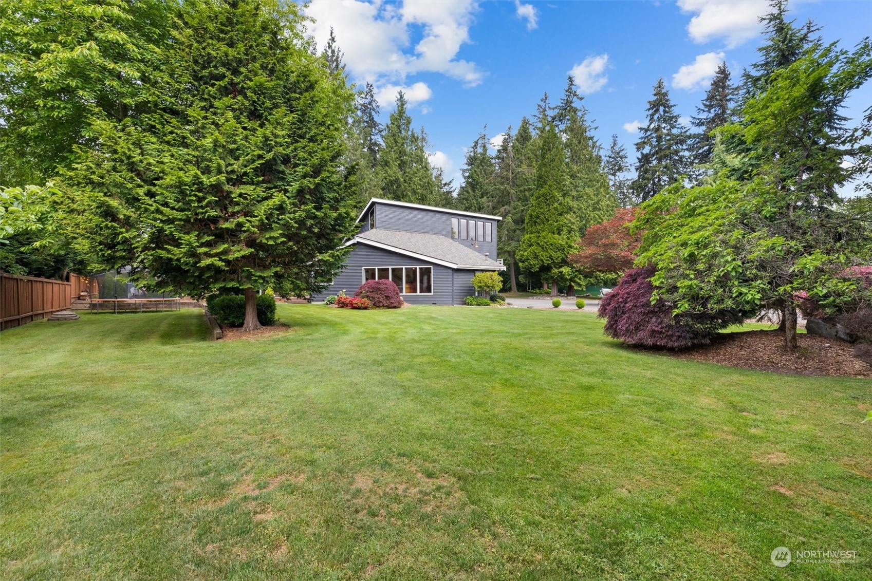 20622 37th Avenue Southeast Bothell, WA 98021 - Photo 36 of 38 a front view of a house with garden