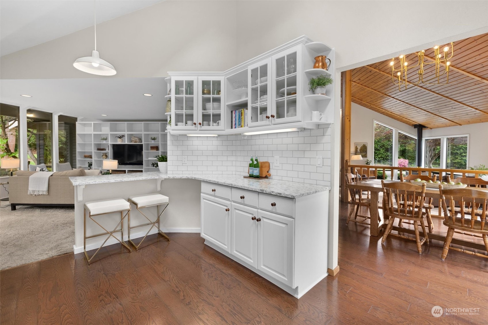 20622 37th Avenue Southeast Bothell, WA 98021 - Photo 10 of 38 a kitchen with a dining table chairs and white appliances