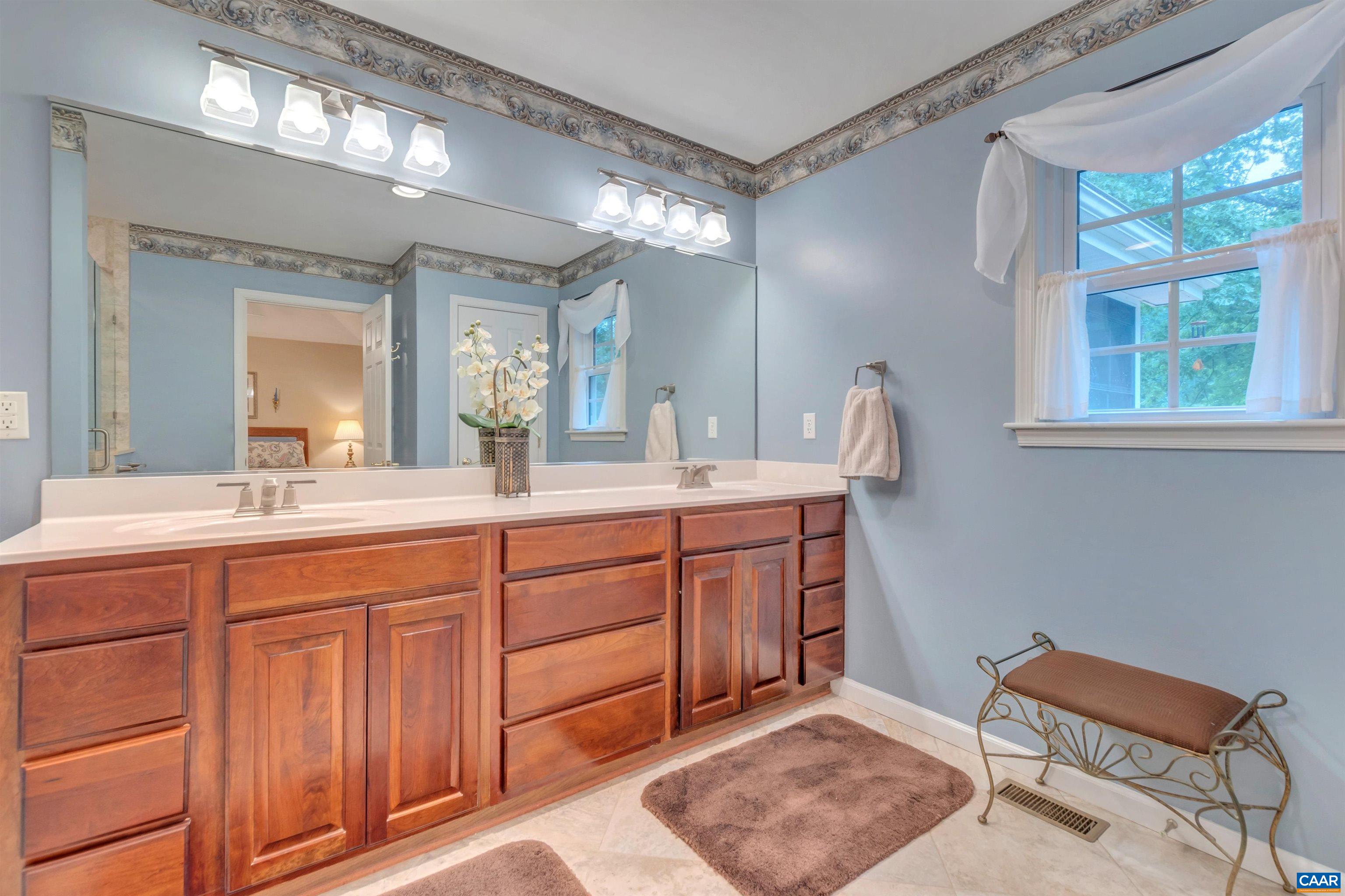 8 Out Of Bounds Road Palmyra, VA 22963 - Photo 48 of 66 a spacious bathroom with a double vanity sink and a mirror