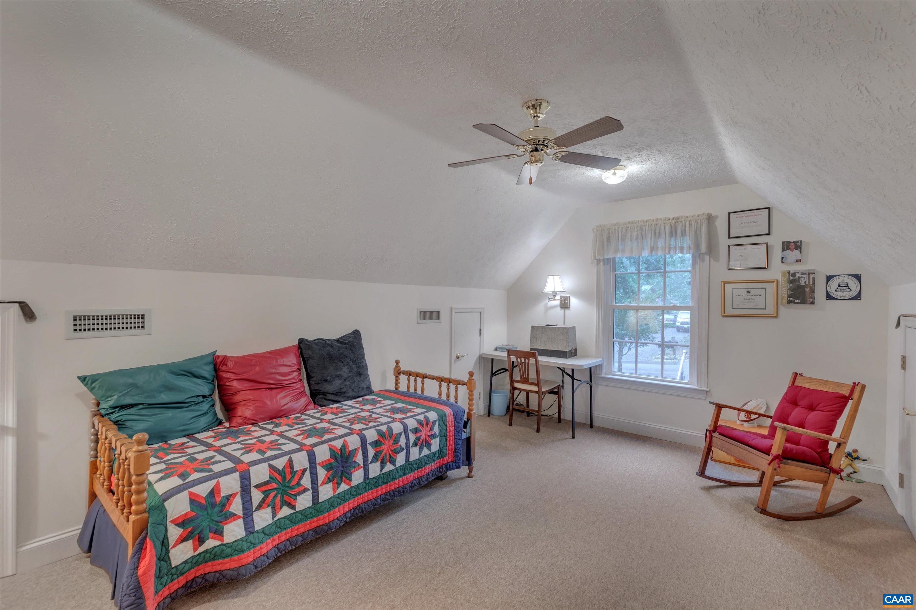 8 Out Of Bounds Road Palmyra, VA 22963 - Photo 10 of 66 a bedroom with furniture and a chandelier
