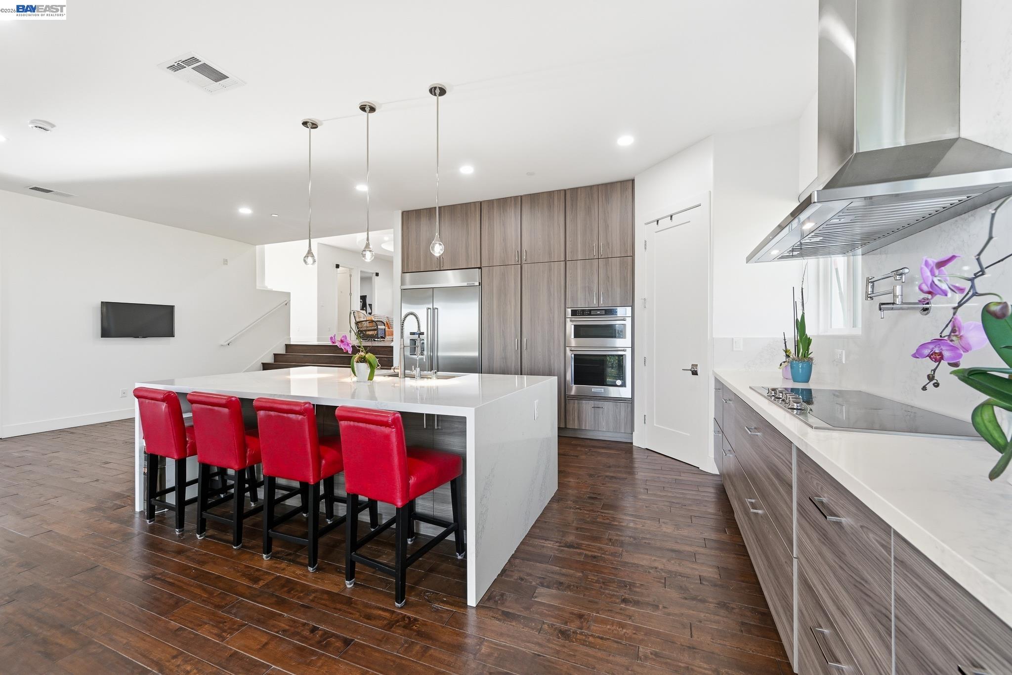 4683 Proctor Road Castro Valley, CA 94546 - Photo 19 of 88 a kitchen with stainless steel appliances kitchen island granite countertop a table chairs sink and cabinets