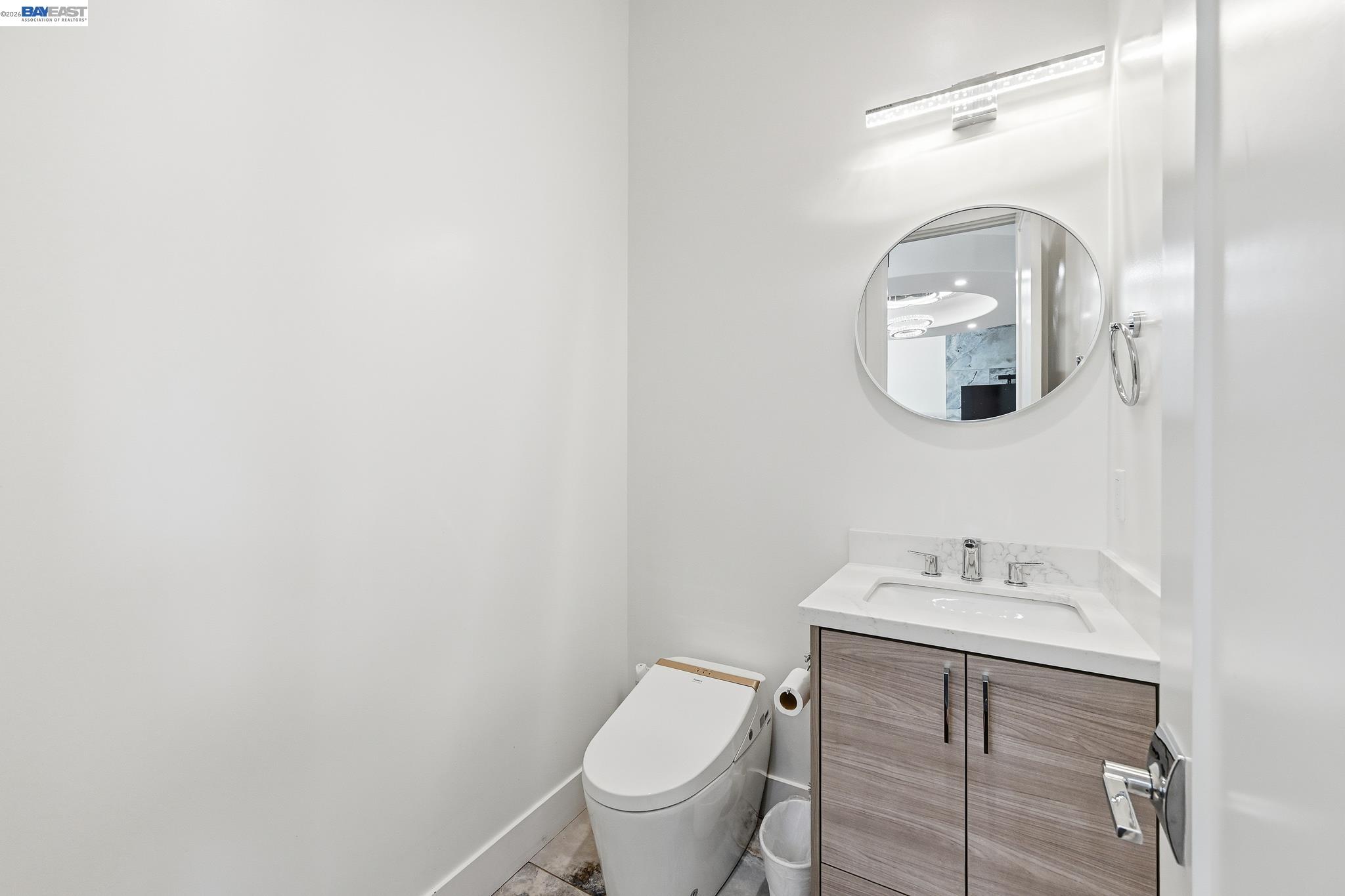 4683 Proctor Road Castro Valley, CA 94546 - Photo 28 of 88 a bathroom with a toilet a sink and mirror