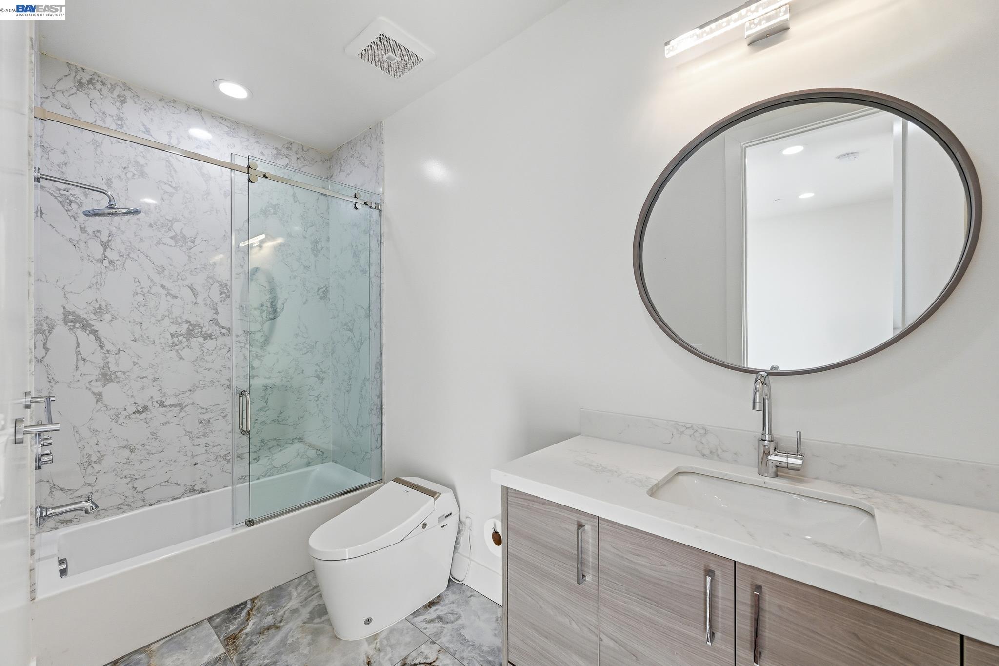 4683 Proctor Road Castro Valley, CA 94546 - Photo 56 of 88 a bathroom with a sink a toilet and a mirror