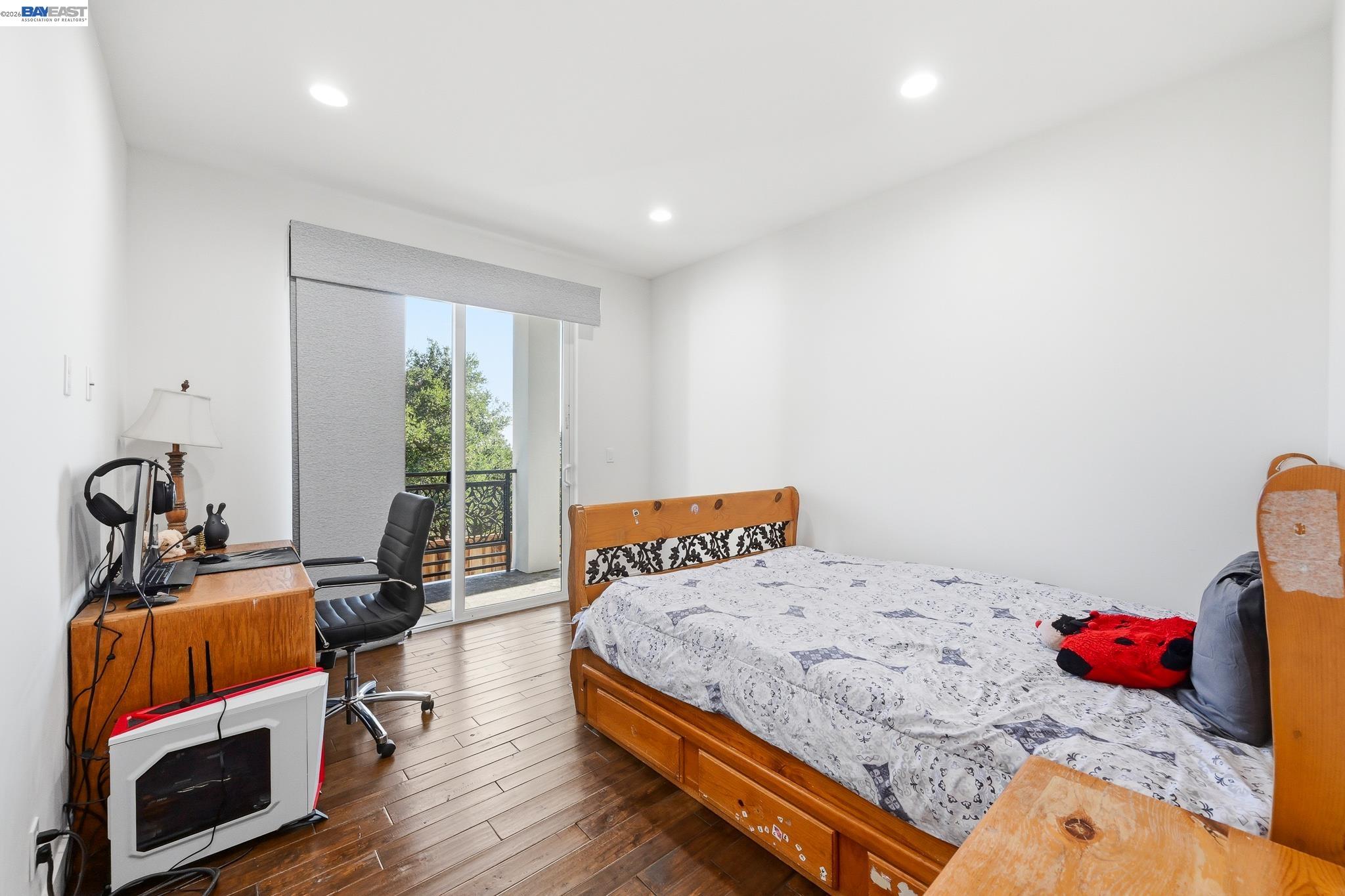 4683 Proctor Road Castro Valley, CA 94546 - Photo 64 of 88 a bedroom with furniture and a wooden floor