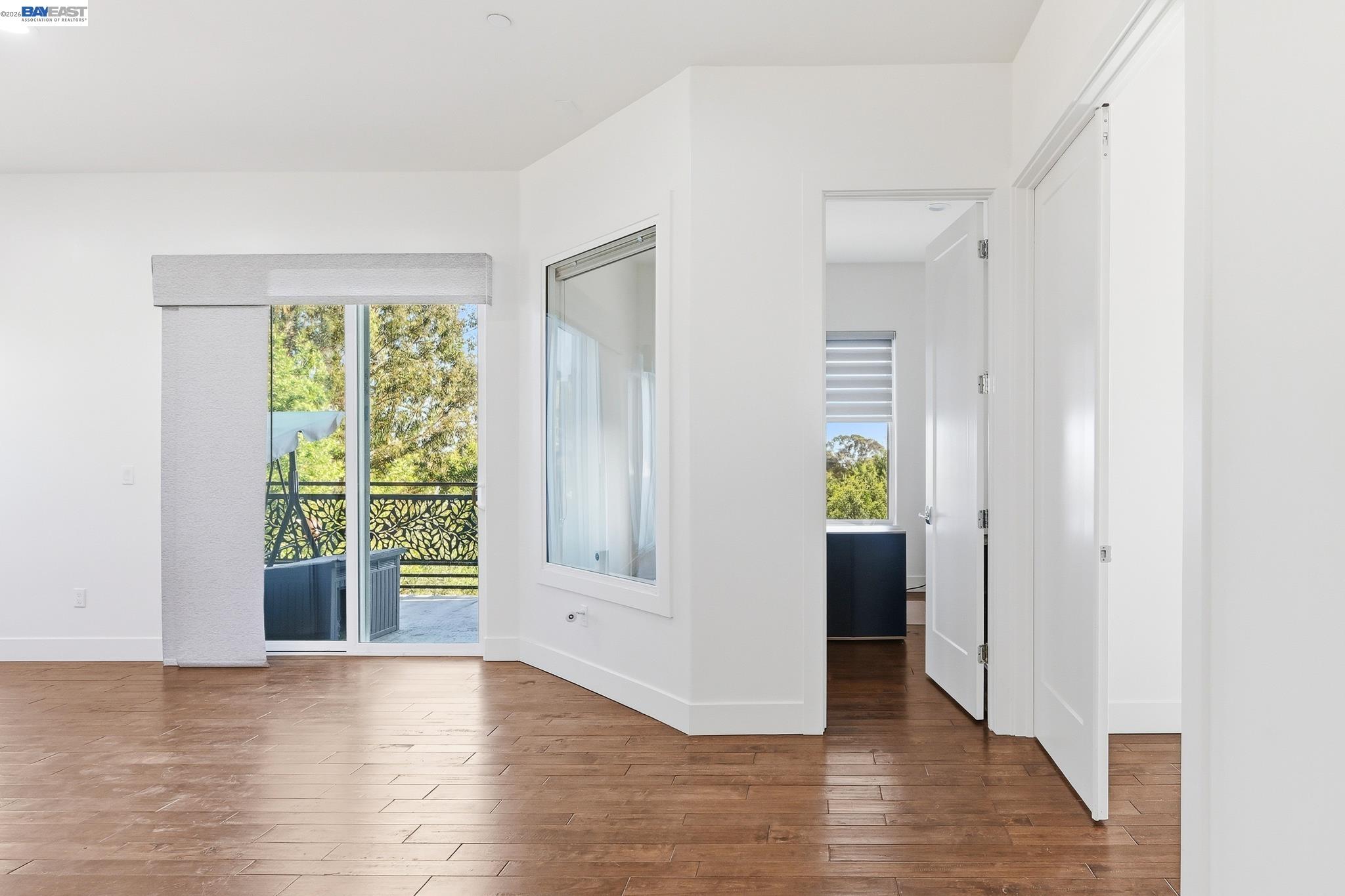 4683 Proctor Road Castro Valley, CA 94546 - Photo 10 of 88 a view of an empty room with wooden floor and a window