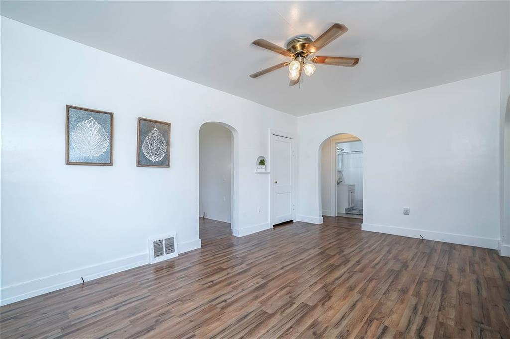 1537 Marshall Road Monaca, PA 15061 - Photo 4 of 25 Neutral decor and ceiling fan complete the living room.
