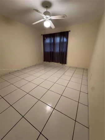 a view of a livingroom and window