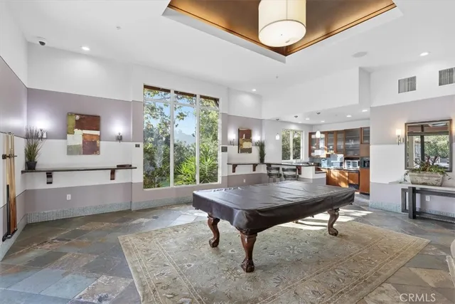 a view of a swimming pool and lounge chair