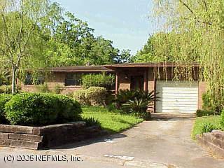 6446 South Ish Brant Road Jacksonville, FL 32210 - Photo 1 of 1 a front view of a house with garden
