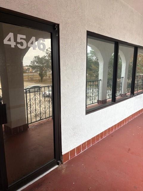 4546 Commercial Way Spring Hill, FL 34606 - Photo 1 of 10 wooden floor in an empty room with a window