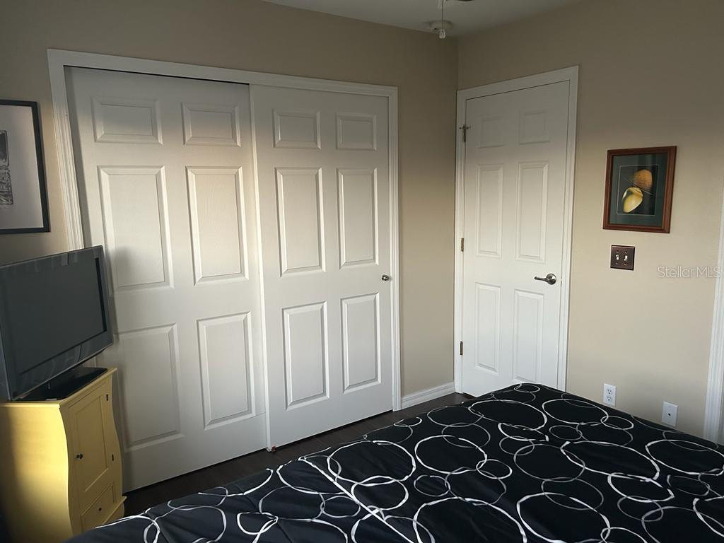 8807 White Sage Loop Lakewood Ranch, FL 34202 - Photo 11 of 19 a bedroom with a bed and a flat tv screen