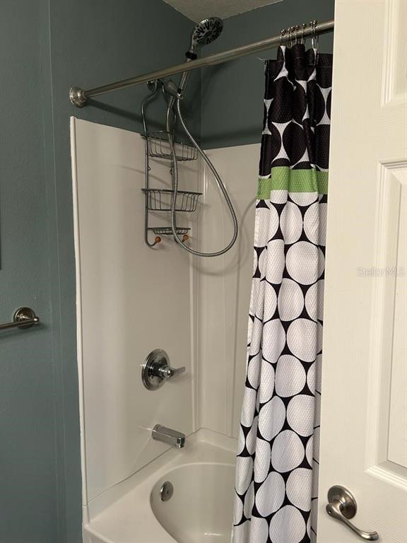 8807 White Sage Loop Lakewood Ranch, FL 34202 - Photo 16 of 19 a bathroom with a shower and a sink