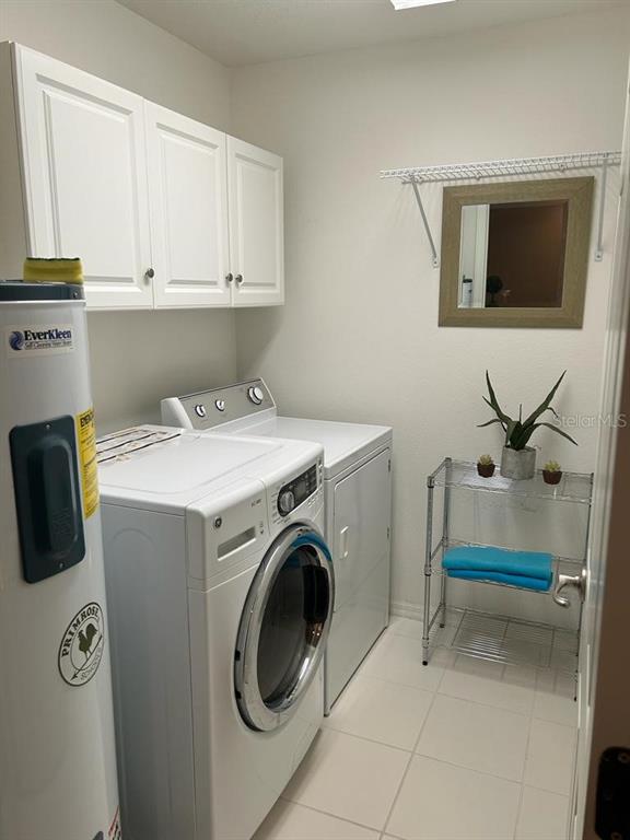 8807 White Sage Loop Lakewood Ranch, FL 34202 - Photo 17 of 19 a utility room with dryer and washer