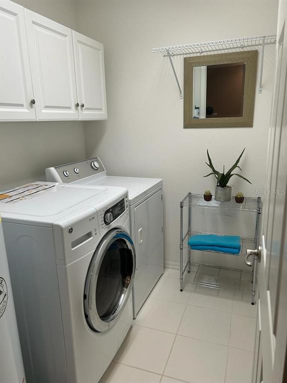 8807 White Sage Loop Lakewood Ranch, FL 34202 - Photo 18 of 19 a utility room with dryer and washer