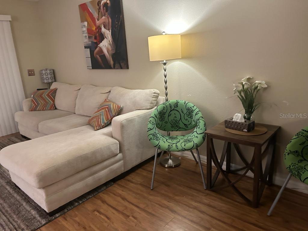 8807 White Sage Loop Lakewood Ranch, FL 34202 - Photo 5 of 19 a living room with furniture and a table