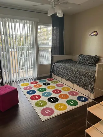 a bedroom with a bed and a table in it