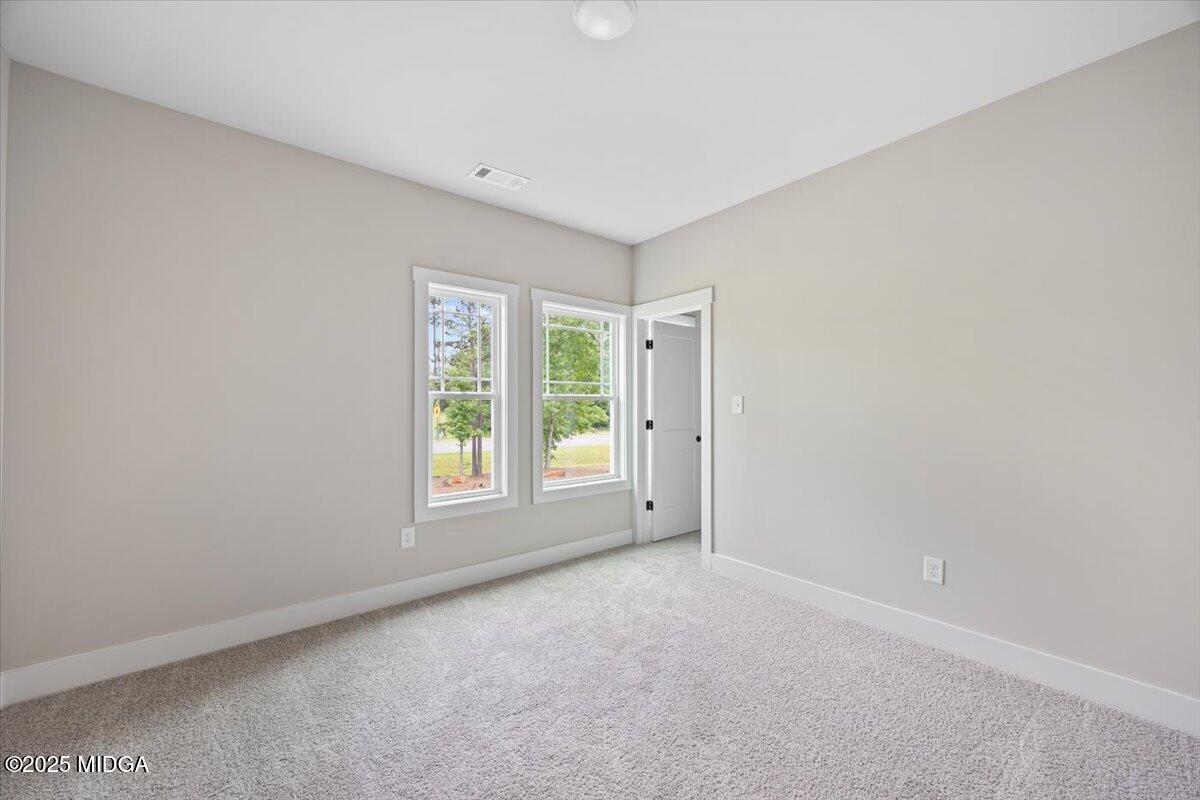 202 Railroad Street Gray, GA 31032 - Photo 10 of 19 a view of an empty room with a window