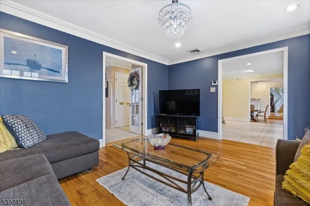 a living room with furniture fireplace and a window