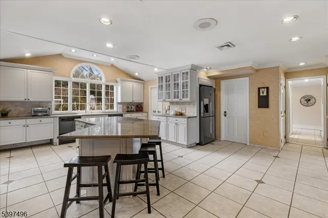 a view of a livingroom with workspace and a window