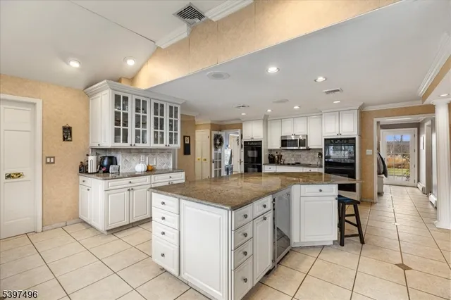 a view of a pathway with a wrought fence