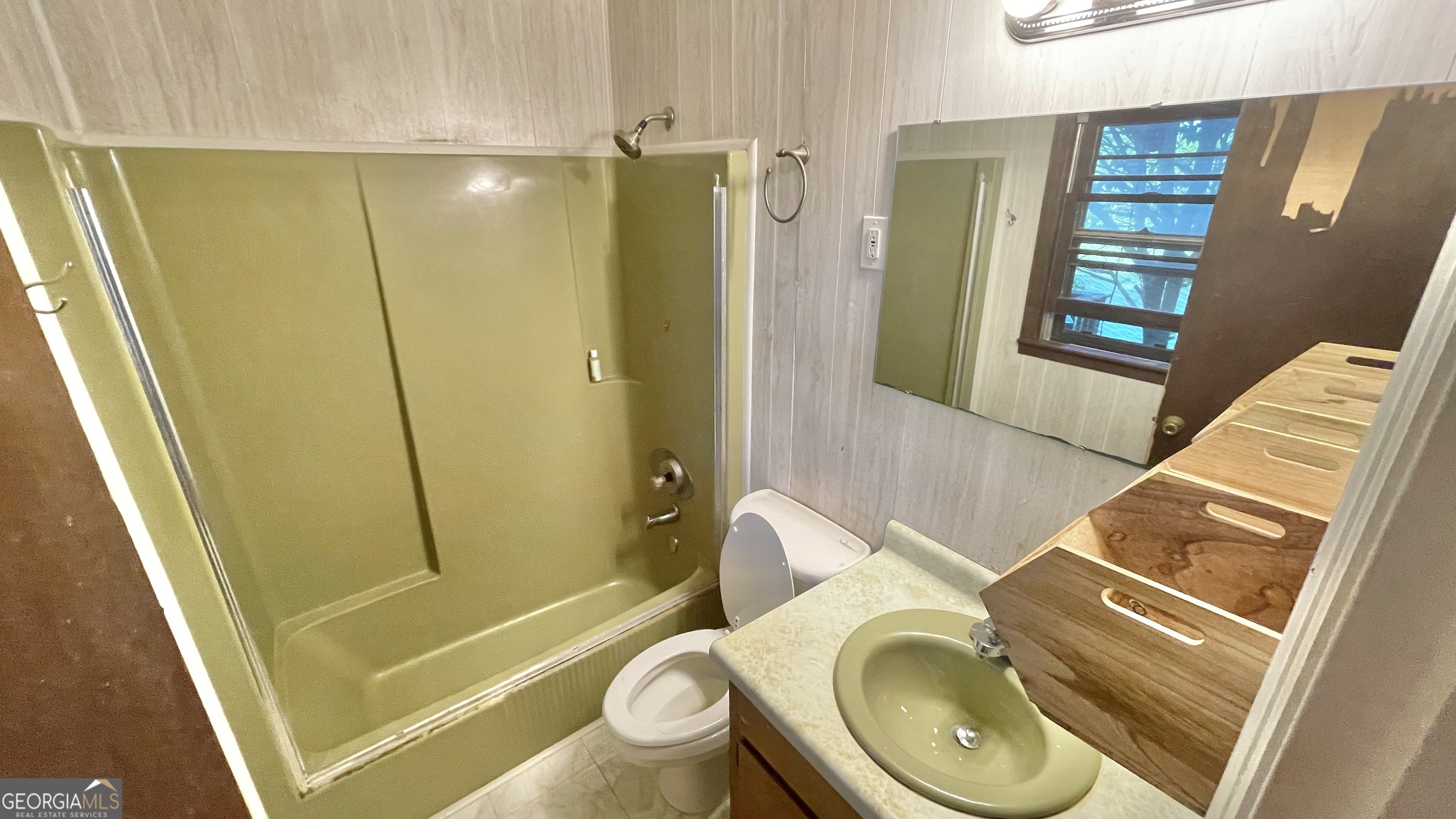 758 Jack Sharp Road Colbert, GA 30628 - Photo 8 of 14 a bathroom with a sink a toilet and shower