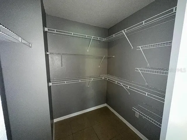 a view of a room with racks on the wall