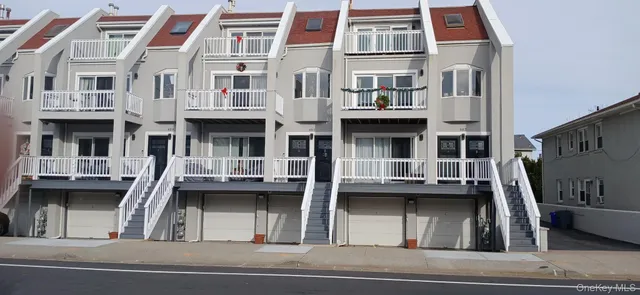 a view of a building with a cars