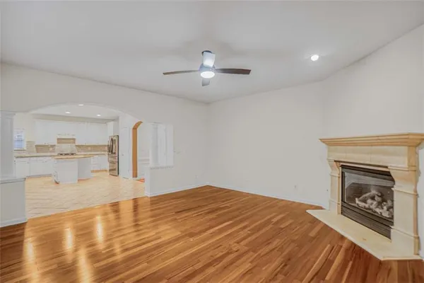 a view of a kitchen with microwave and cabinets