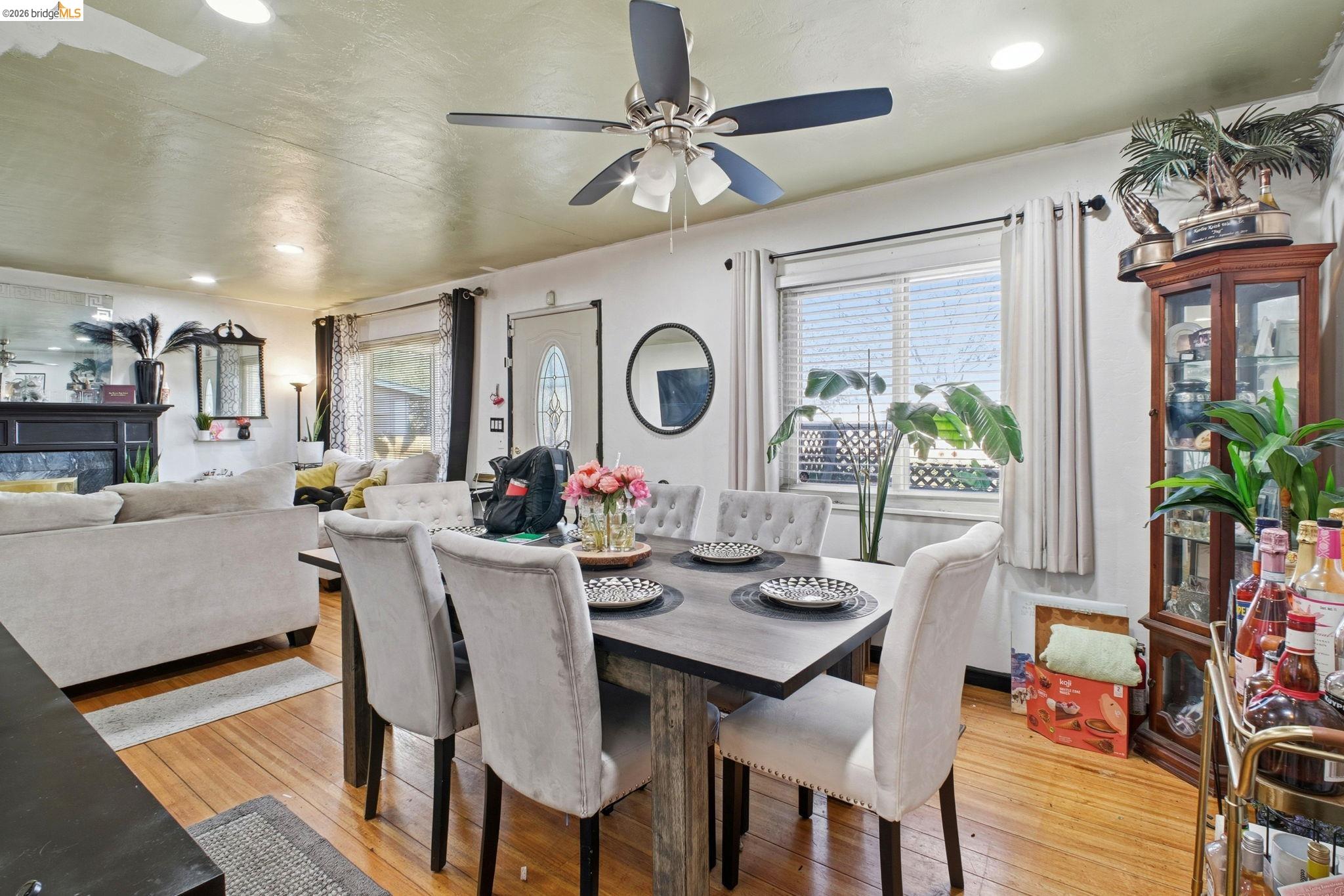 127 Hampton Road Hayward, CA 94541 - Photo 11 of 22 Dining area with light wood finished floors, recessed lighting, and a glass covered fireplace