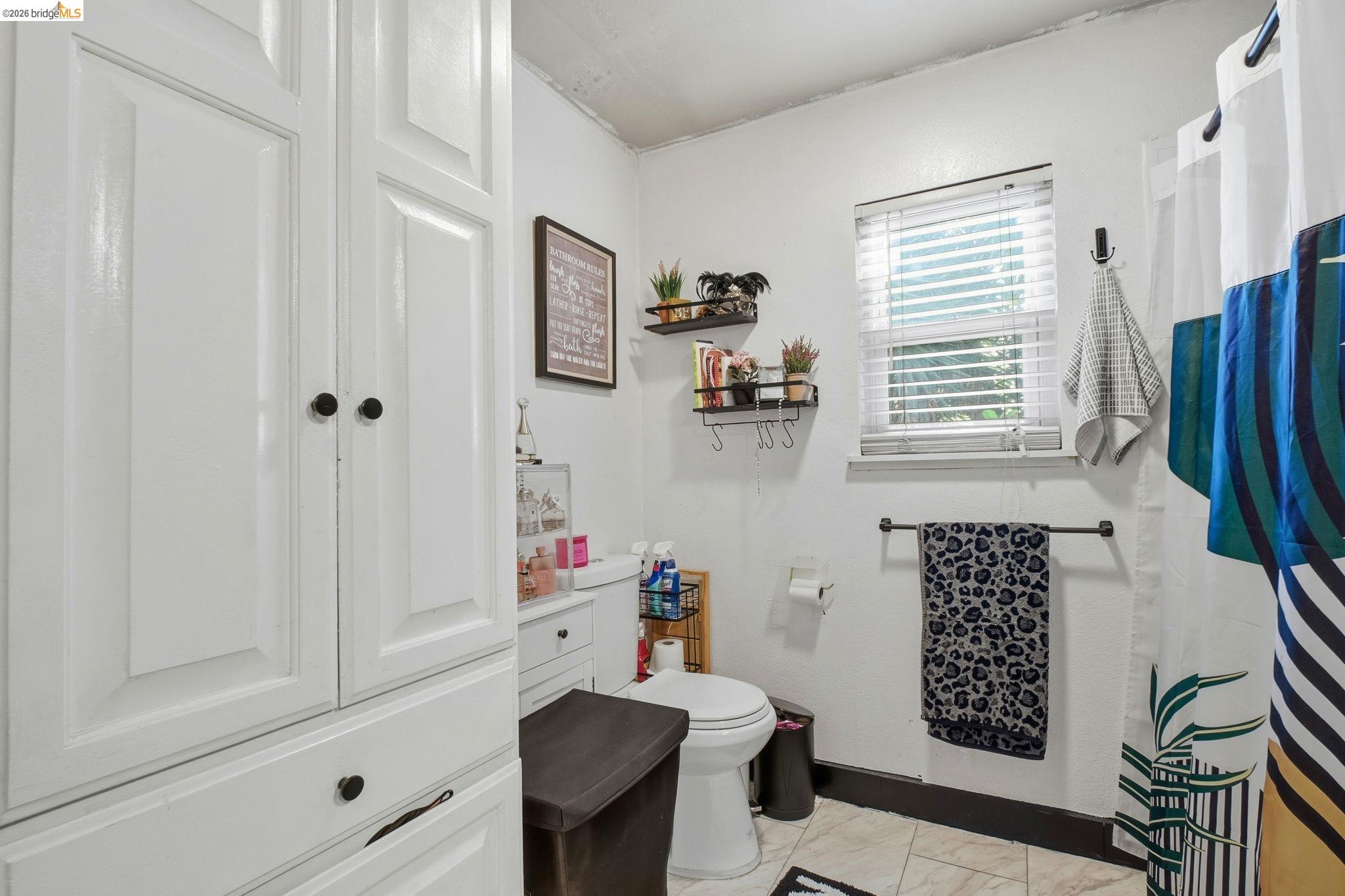 127 Hampton Road Hayward, CA 94541 - Photo 14 of 22 Full bath with a shower with shower curtain and light marble finish flooring