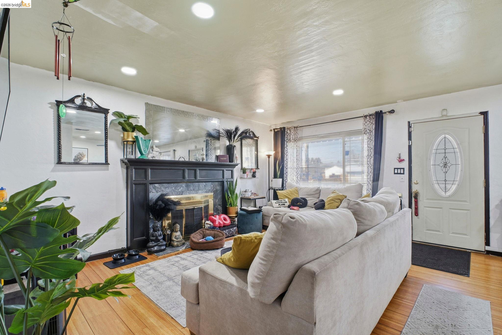 127 Hampton Road Hayward, CA 94541 - Photo 6 of 22 Living room with light wood finished floors, a glass covered fireplace, and recessed lighting