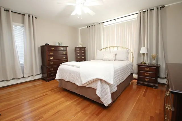 a bedroom with a bed and a dresser