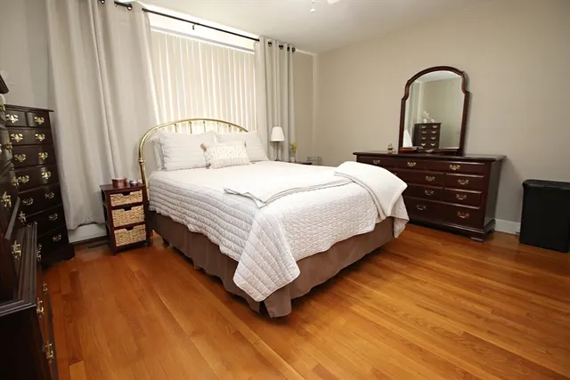 a bedroom with a bed and a dresser