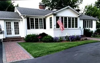 a front view of a house with a yard
