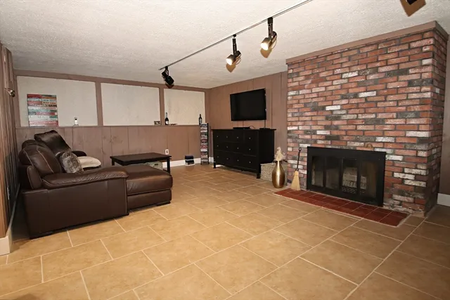 a spacious bedroom with a bed and window